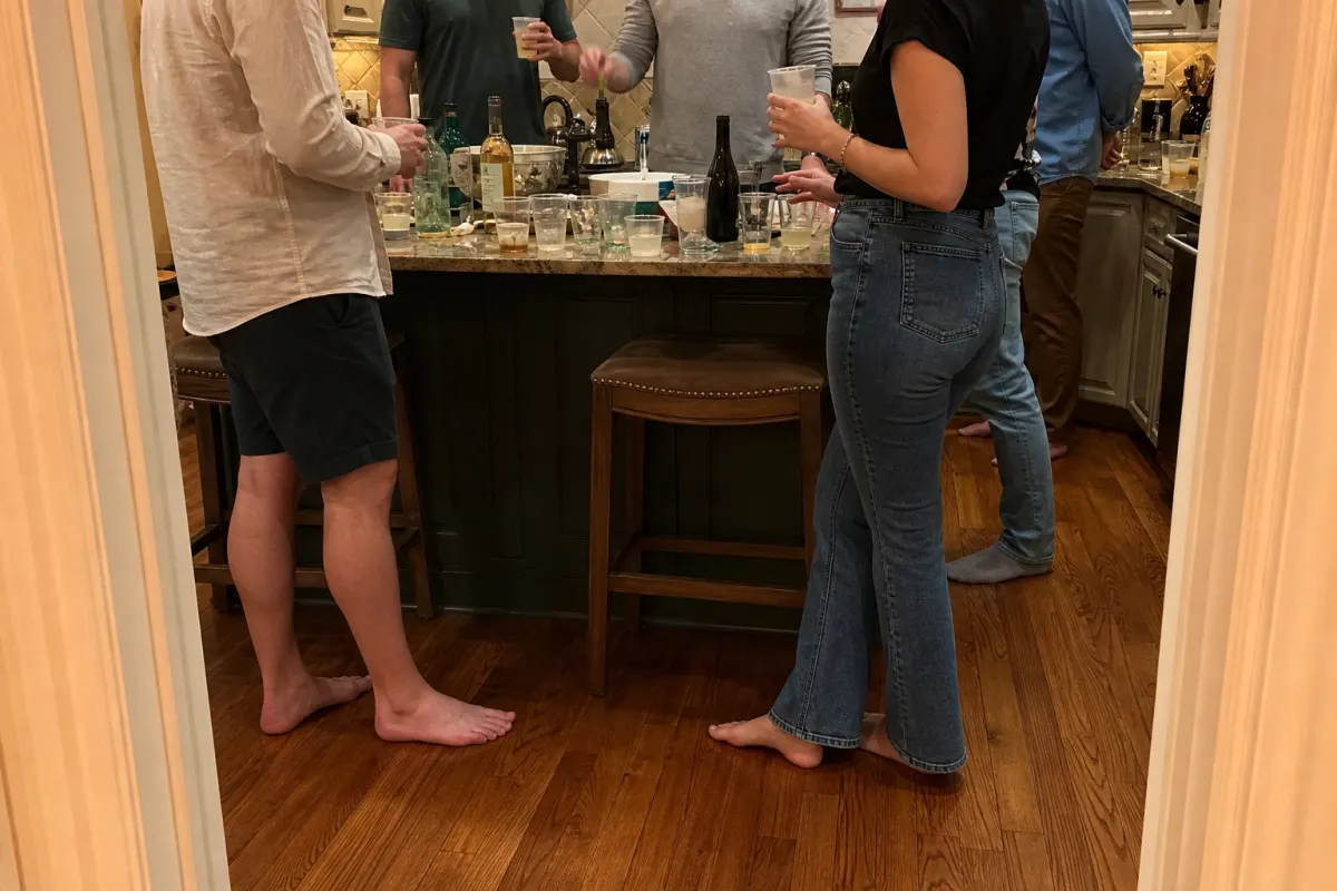 A crowded kitchen at a house party