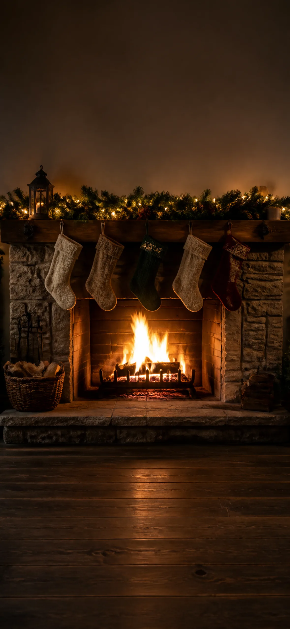 Christmas wallpaper for phone — a lit fireplace with stockings hung on a decorated mantel