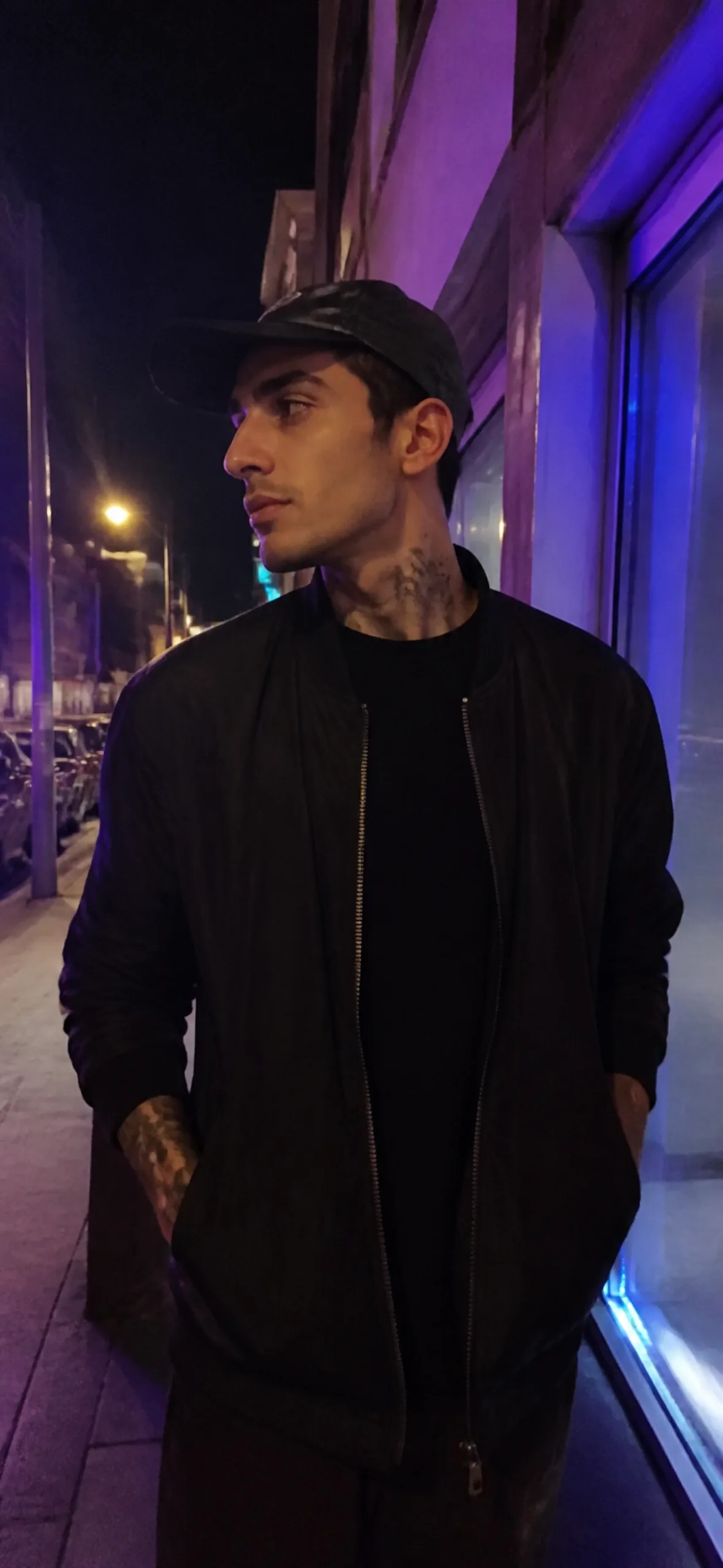 Fake call wallpaper — man on a neon-lit street at night