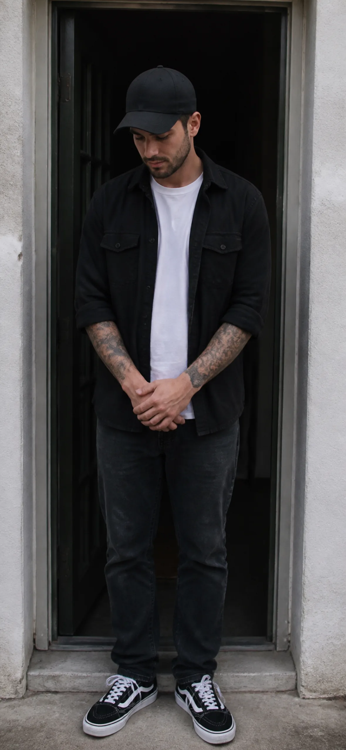 iPhone wallpaper — man in a cap standing in a doorway