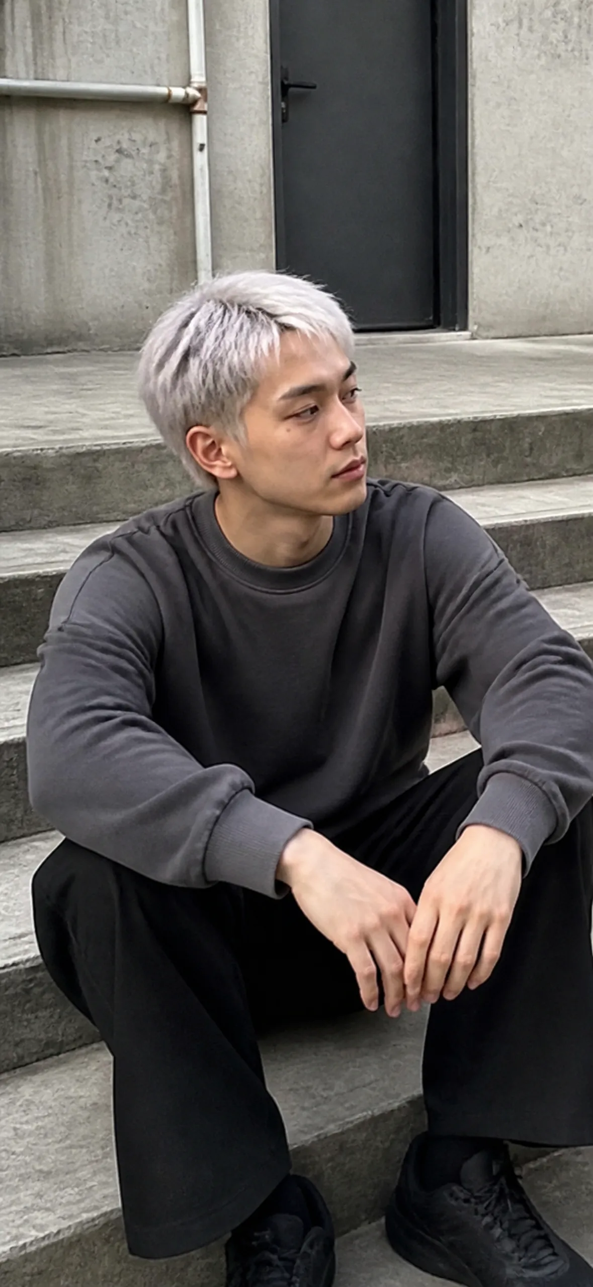 iPhone wallpaper — silver-haired man sitting on steps