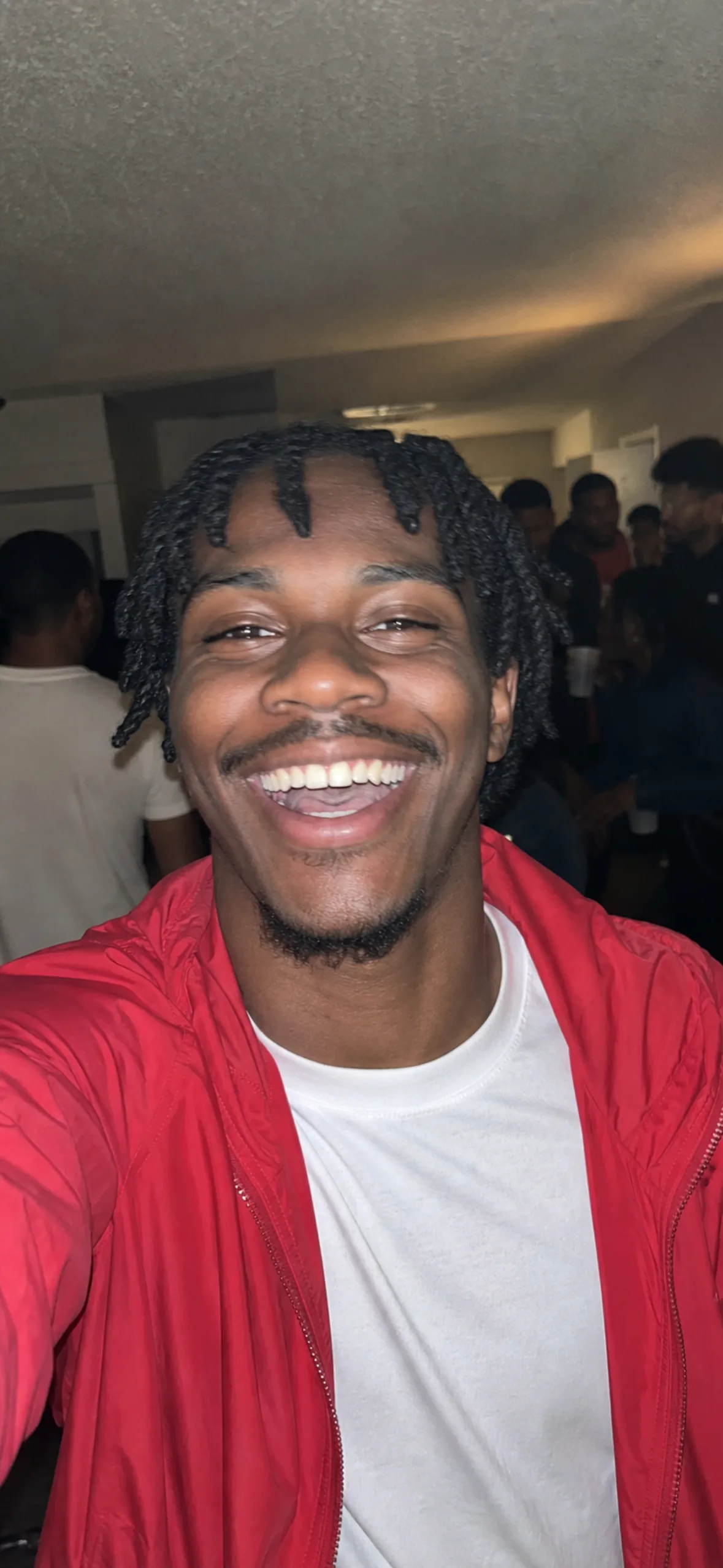 Phone wallpaper — flash photo of a man at a party