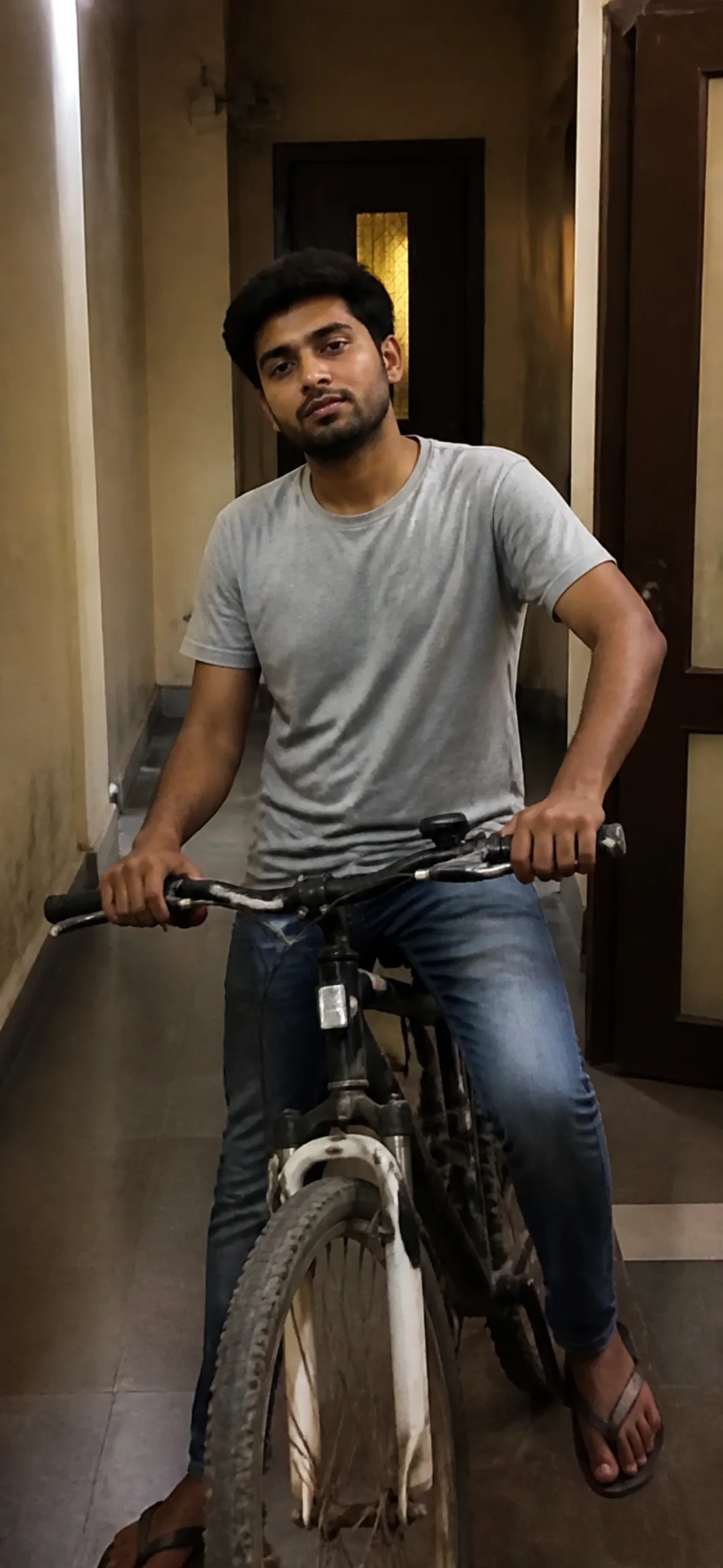Prank call wallpaper — man with a bicycle in a corridor